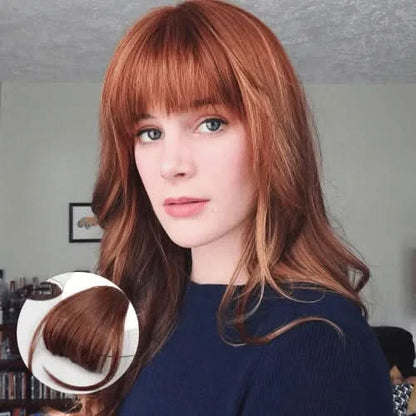 Frange à clipser sur cheveux auburn mi-longs